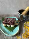Japanese dango skewers topped with chunky sweet red bean paste