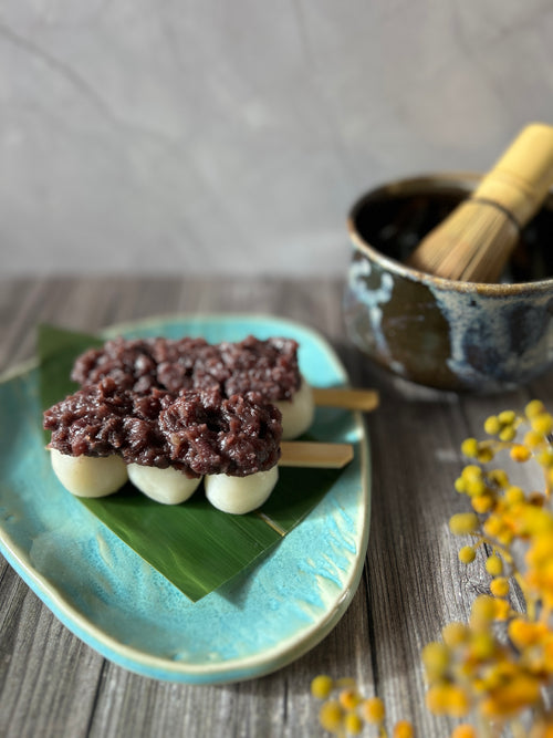 Japanese dango skewers topped with chunky sweet red bean paste