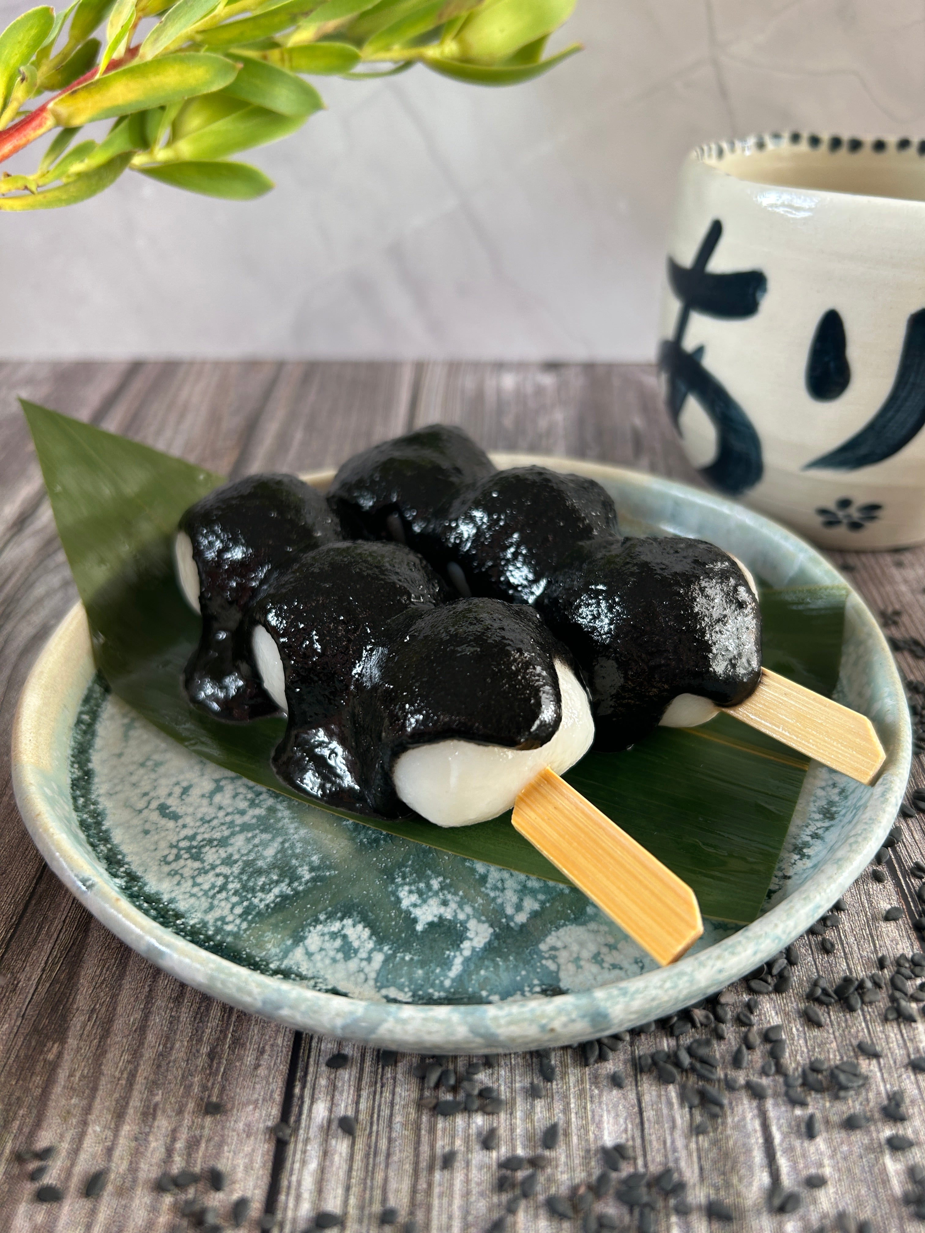 Japanese dango skewers topped with black sesame paste