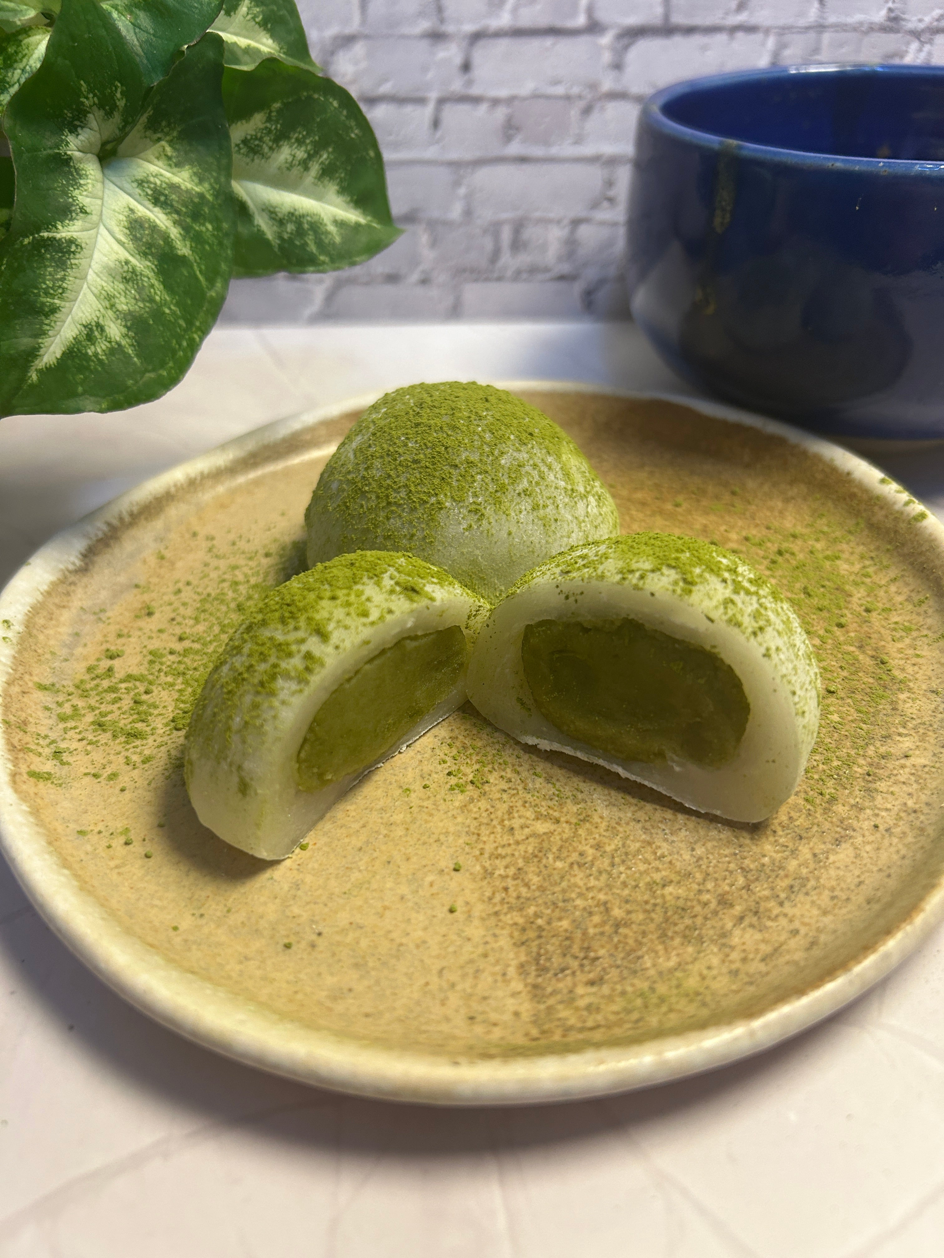 Handmade matcha daifuku filled with smooth white bean paste
