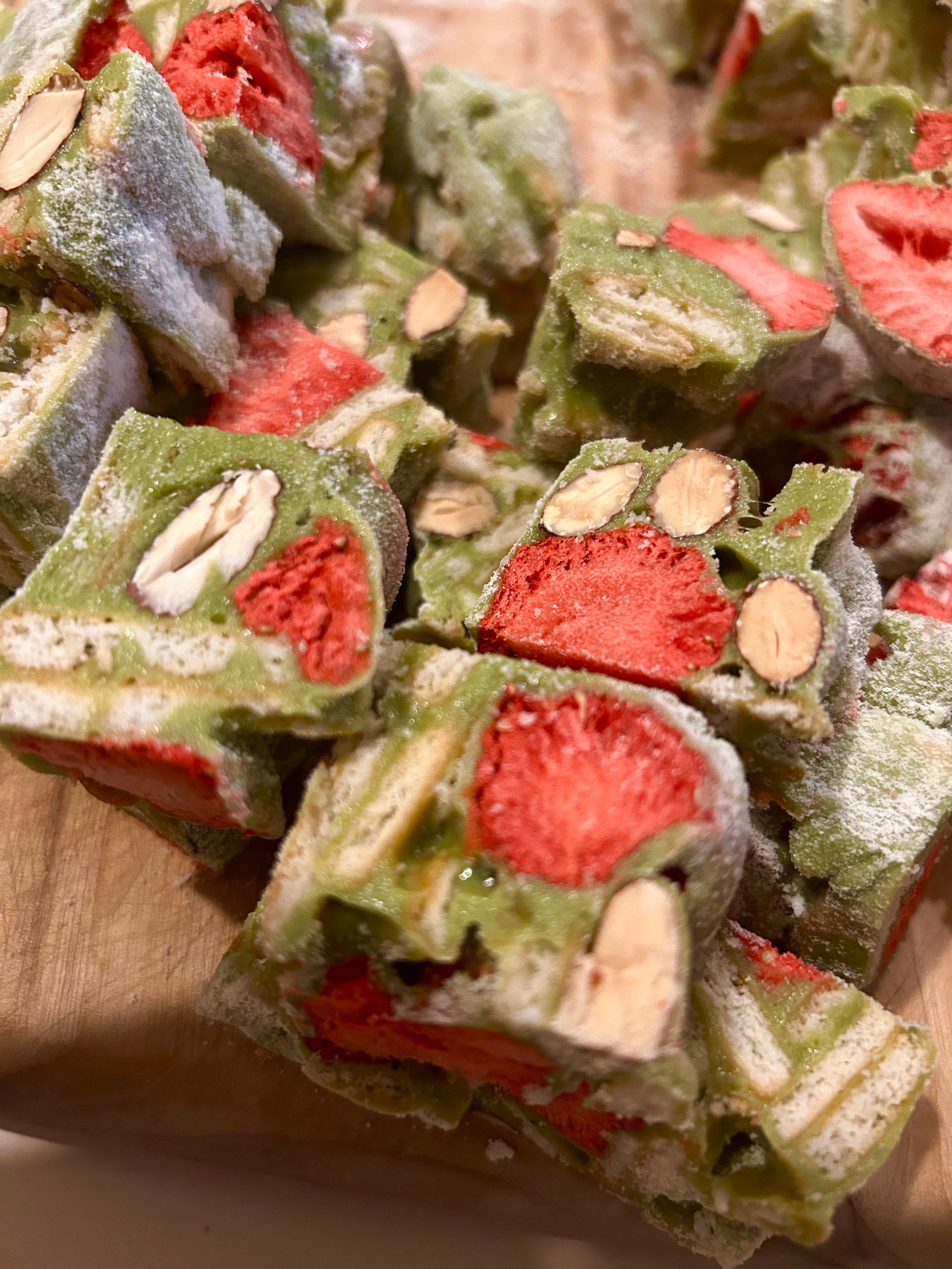 Handmade matcha strawberry nougat with crunchy biscuits, freeze-dried strawberries and roasted almonds