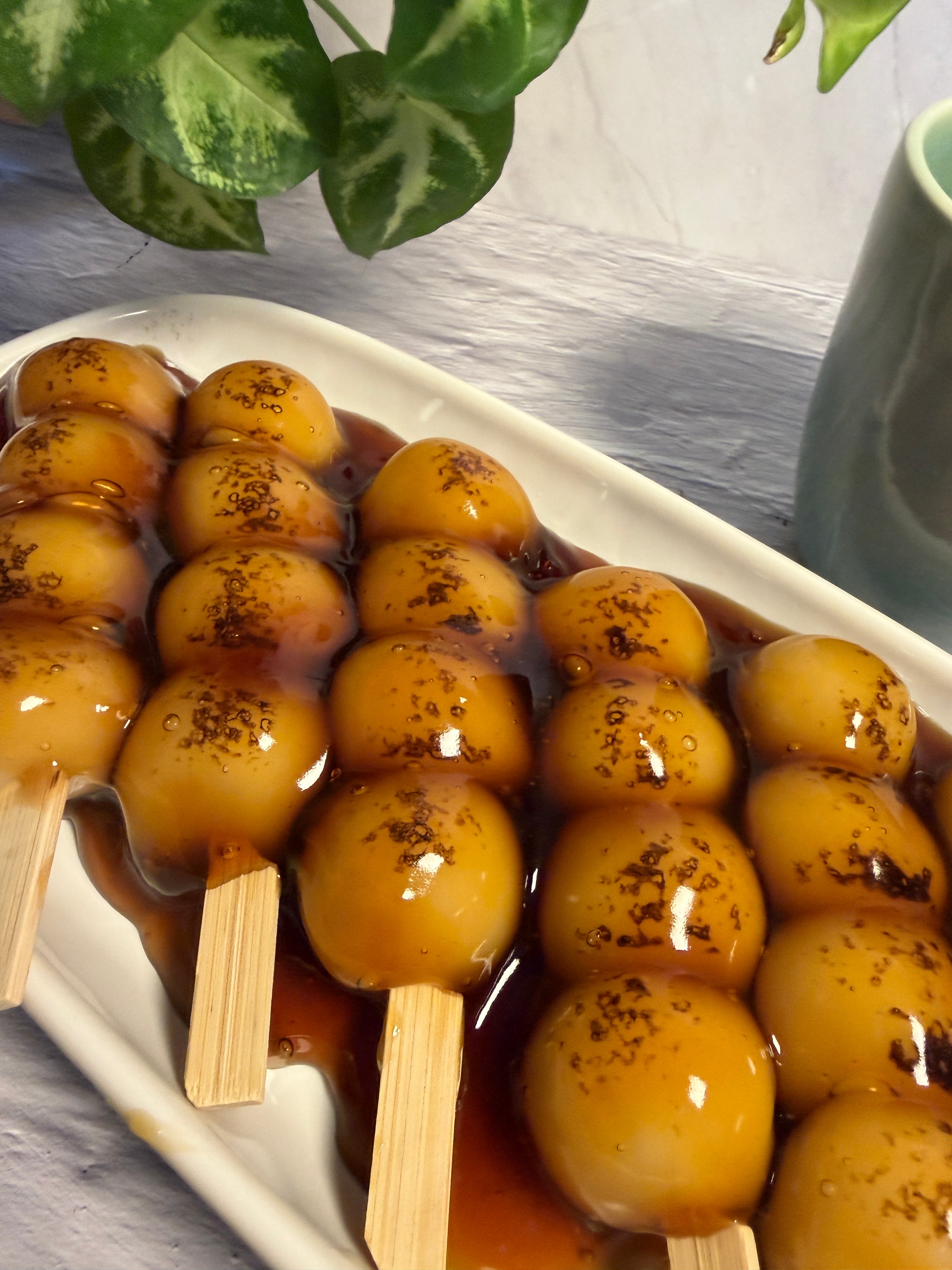 Handmade Japanese mitarashi dango skewers with sweet soy glaze